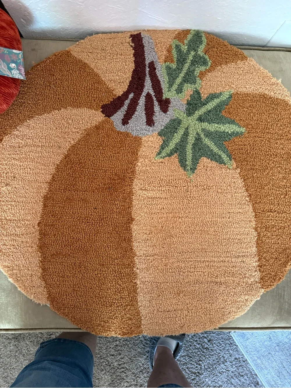 Autumn Pumpkin Accent thick and plush hooked Rug , and an orange cloth pumpkin.